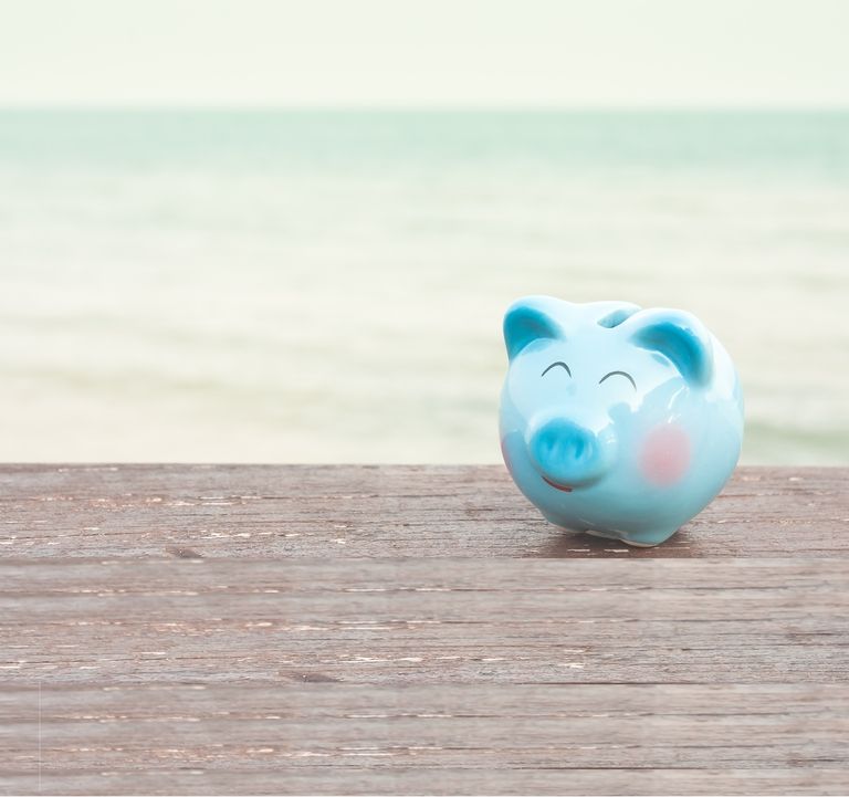 Een afbeelding van een blij spaarvarken